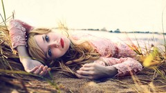 Woman outdoors blondes blue eyes lying down relaxing