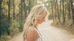 Woman outdoors blondes forests blurred background