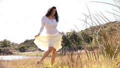 Woman outdoors white dress models black hair curly hair nipples 