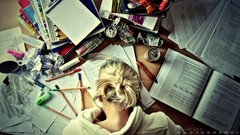 Woman paper Books Pencils Tables drinks blondes Students school 