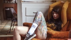 Woman piercing tattoos couch Radeo (SuicideGirls)