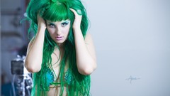 Woman piercings bangs green hair pices