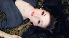 Woman piercings models lying down