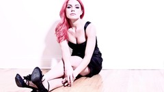 Woman pink hair black dress pale skin