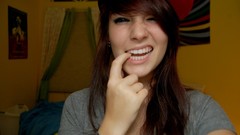 Woman redheads fingers on lips baseball caps