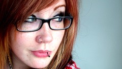 Woman redheads glasses pierced