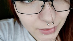 Woman redheads glasses piercings