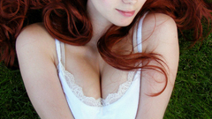 Woman redheads grass cleavage