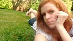 Woman redheads grass cleavage