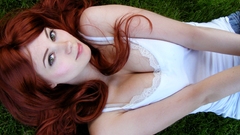 Woman redheads grass cleavage
