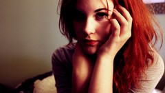 Woman redheads hands on head