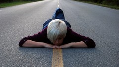 Woman roads white hair short hair lying down