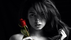 Woman roses black background selective coloring