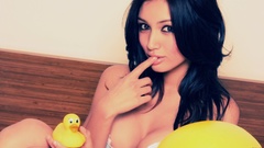 Woman rubber ducks Misa Campo fingers on lips