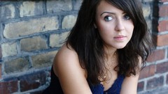 Woman shoulders blue eyes brunettes cleavage brick wall teen