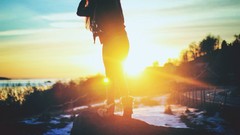Woman silhouettes rocks sunlight snow landscapes