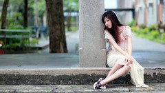 Woman sitting asians streets white dress