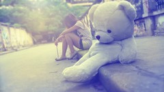 Woman sitting curb asians teddy bears