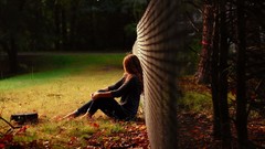 Woman sitting fences long hair brunettes fallen leaves