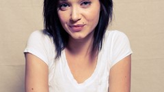 Woman sitting smiling blue eyes brunettes black hair Sierra Love