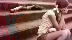 Woman sitting thinking