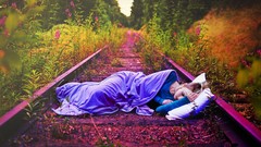 Woman sleeping blanket pillows lying down railroad tracks girls 