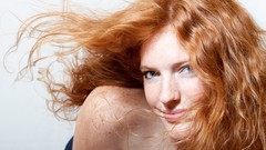 Woman smiling blue eyes freckles redheads