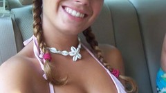 Woman smiling pigtails cleavage bikini bikini top