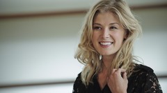 Woman smiling Rosamund Pike
