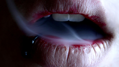 Woman smoke lips piercings