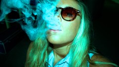 Woman smoke marijuana sunglasses