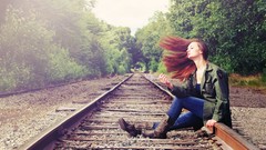 Woman smoking redheads railroad tracks leather boots