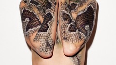 Woman snakes tattoos poses