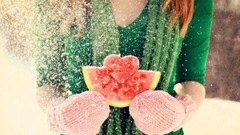 Woman snow watermelons mittens