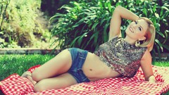 Woman stomach models lying down denim shorts