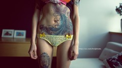 Woman stomach navel legs tattoos models