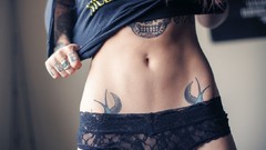 Woman stomach navel tattoos boobs