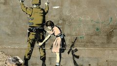 Woman streets soldier banksy