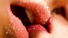 Woman sugar close-up lips kissing lesbians