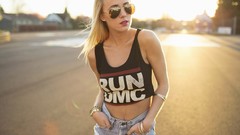 Woman sunglasses blondes hands in pockets