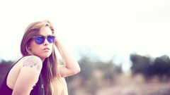 Woman sunglasses tattoos