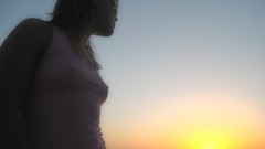 Woman sunset nipples through