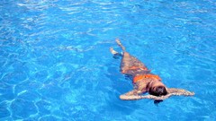 Woman swimming pools