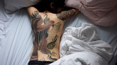 Woman tattoos back view models panties topless
