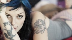 Woman tattoos blue hair