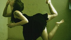 Woman tattoos brunettes black dress levitation