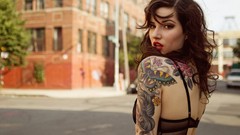 Woman tattoos cityscapes