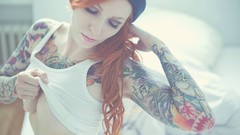 Woman tattoos closed eyes redheads no bra underboobs