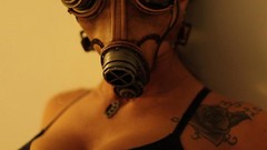 Woman tattoos gas masks