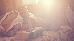 Woman tattoos light rays